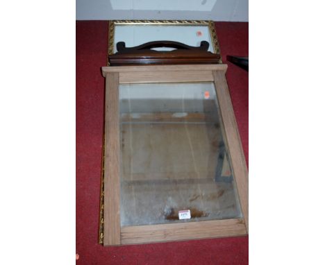 An Edwardian faded walnut framed mirror; one other; and a gilt example (3) 