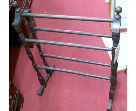 A stained and turned towel rail, together with a metal bound soft wood trough, and a pine pizza bread board tray (3)