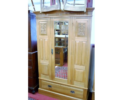 An Edwardian satin walnut single mirror door wardrobe having single long lower drawer, width 125cm