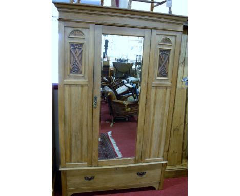 An Edwardian satin walnut single mirror door wardrobe having single long lower drawer, width 133cm