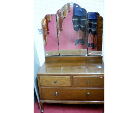 A 1930s mahogany triptych mirror back dressing chest