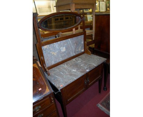 An Edwardian mahogany chequer strung swing mirror back marble top wash stand, having twin cupboard doors