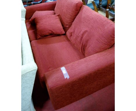 A modern red upholstered two-seater sofa