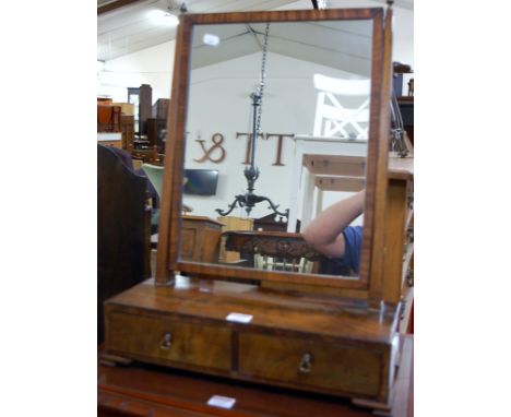 A 19th century flame mahogany swing mirror back dressing table mirror, having two drawer box base, width 43cm