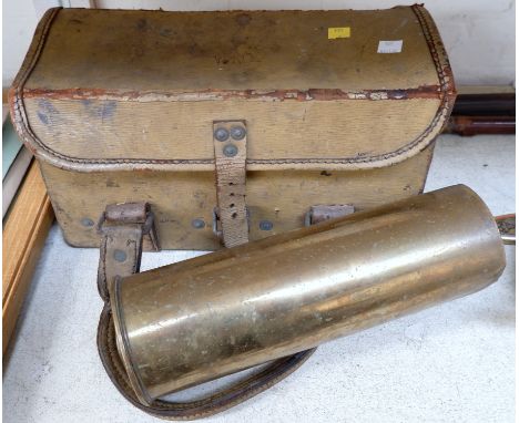 A WD leather ammunition case and a brass shell case