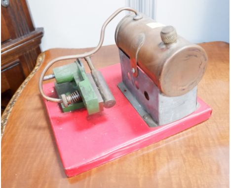 A stationary spirit driven steam engine