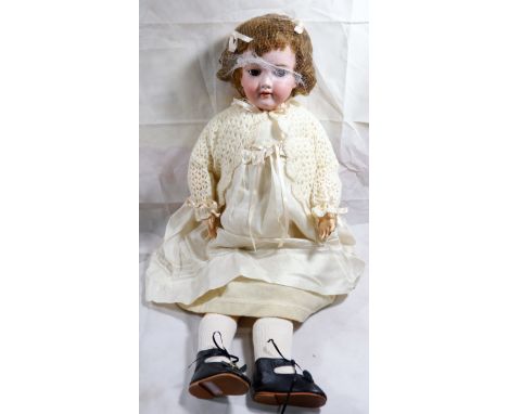 A Victorian German pot headed doll with articulated joints, sleepy eyes by Heinrich Handwerck stamped to back of head 119-12 