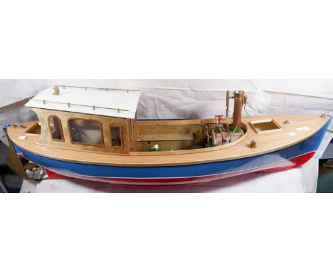 A scratch built wooden model cabin cruiser driven by gas fuelled simulated steam engine, length 46.5"