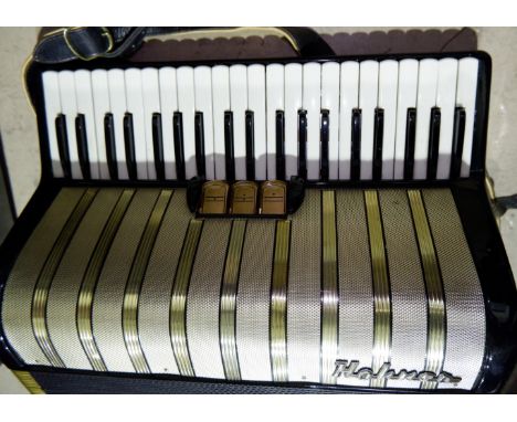 A Horner 120 base piano accordion in case