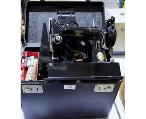 A Singer electric sewing machine model 222K in original box complete with accessories etc. (sold as a collector's item only)