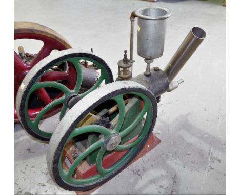 A vintage single cylinder internal combustion stationary engine with twin 141/2'' flywheels