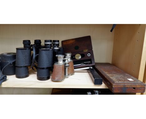 A cased steel and brass spirit level; boxed dies; 3 pairs of binoculars and Zenit camera