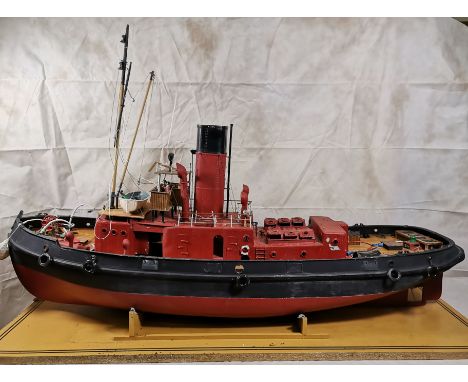 A scratch built tug boat powered by gas driven diesel type engine, extended length 45"