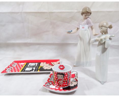 A seated Betty Boop nurse figure, a Betty Boop cup, saucer and plate; 2 Nao figures of girls (one a.f.) a Victorian style dol