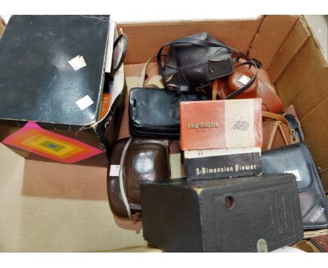 A selection of camera equipment, binoculars etc