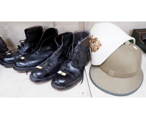 2 pairs of ammunition books; a reproduction British Army tropical helmet and another