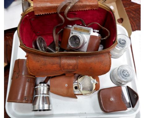 A 1950's Agfa 35mm camera with various lenses and equipment in leather bag