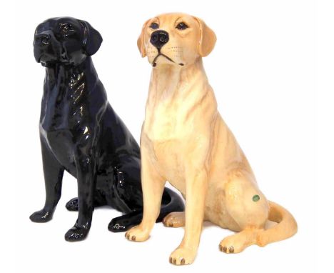 Two Beswick fireside Labradors, in black and tan colourways, 33cm high     Condition report: No damage, restoration or crazin