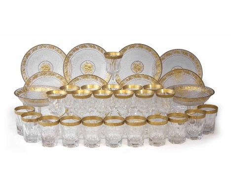 Intaglio cut glass dessert service, with central gilded floral bosses surrounded by a diamond cut band and floral gilt border