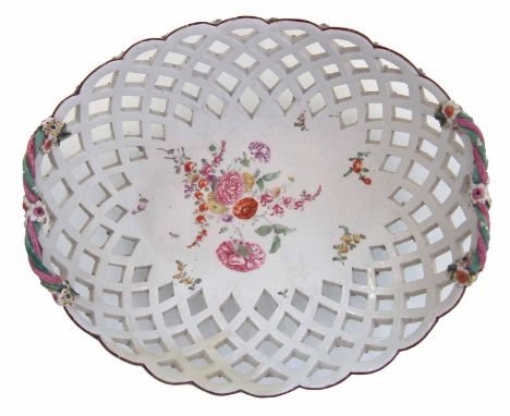 Derby basket circa 1760, with pierced sides applied with floral bosses, twisted branch handles painted with a bold floral spr