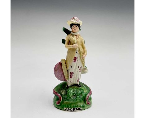 An early 19th century Staffordshire pottery figure of a lady, the naturalistic base inscribed "Archair", height 17.5cm.Condit