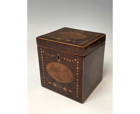 A George III burr walnut and inlaid mahogany tea caddy, of square form and with oval panels, the cover opening to reveal a si