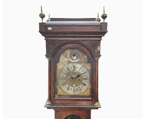 A George III oak eight day longcase clock, signed 'Hampson, Wrexham, 731', the arched dial with a silvered chapter ring, roll