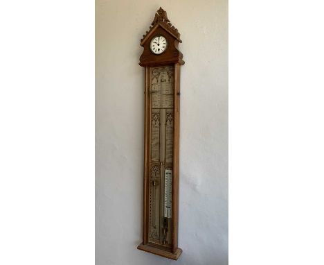 A Victorian Admiral Fitzroy wall barometer, fitted with thermometer, the carved oak case with an inset clock above a diamond 