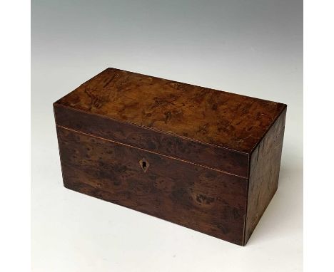 A George III burr yew tea caddy, with two hinged compartments flanking a glass mixing bowl, height 15cm, width 29cm, depth 14