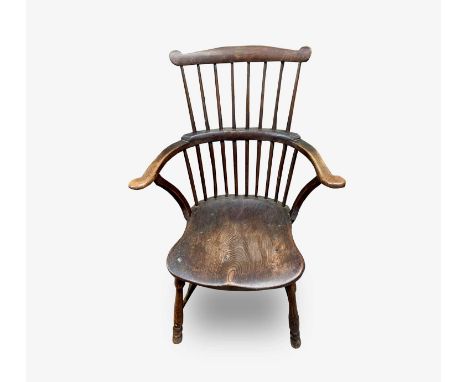 An ash and elm 'comb back' Windsor armchair, 19th century, height 94cm, width 60cm.Condition report: Front leg broken and det