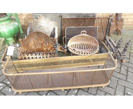 A collection of fireside effects to include; three various fire baskets, two spark guards, pierced brass fender, squat nurser