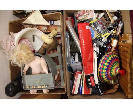 Two boxes containing a mixed quantity of vintage children's dolls, tinplate toys, diecast vehicles and other novelties, to in