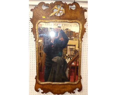 A Chippendale style walnut and parcel gilt framed fret cut wall mirror, 93 x 53.5cm