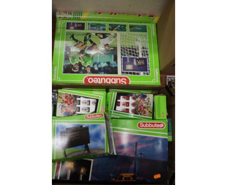 A collection of mixed 1980s Subbuteo to include various teams, scoreboards, gift sets, and sideline accessories