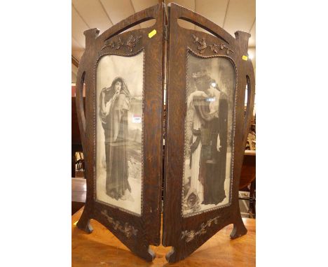 An Art Nouveau oak two-fold fire screen, with figural inset black &amp; white prints and raised floral decoration, each panel