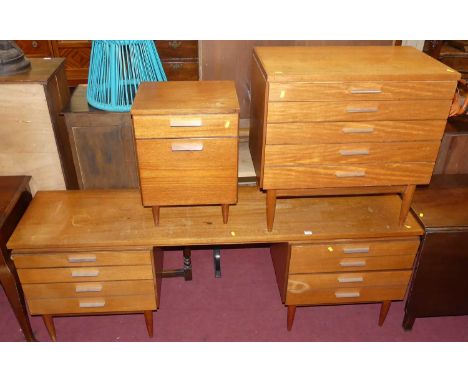 1970s teak bedroom furniture, to include; a kneehole long dressing table, w.182cm; a low compact chest of five long graduated