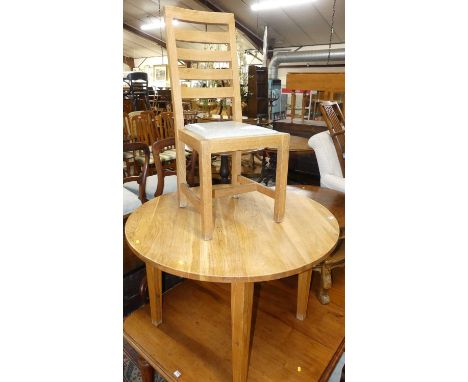 A contemporary blond oak breakfast suite, comprising; circular table on square tapering supports, dia. 110cm, and a set of fo