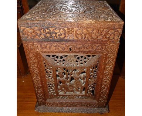 A 19th century Burmese carved teak tantalus case, 41 x 31 x 29cmLacking one inset side panel
