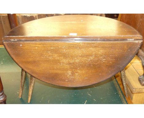 A 1960s Ercol dark elm single dropflap low gateleg occasional table