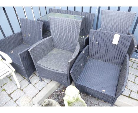 Woven rattan patio garden furniture to include; two seater bench, four armchairs and a glass inset occasional table (6)