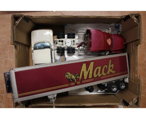 A Franklin Mint loose diecast group to include a Mack tractor unit &amp; trailer, and a 1960s Chevrolet Impala