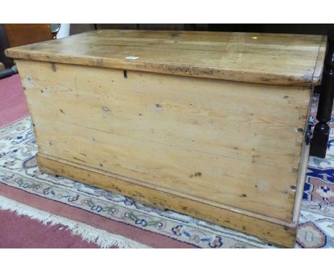 A Victorian pine hinge topped tool chest, having iron end carry handles, w.94cm