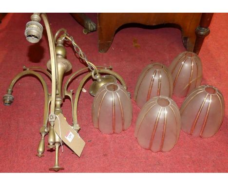 An Art Nouveau brass framed three-branch hanging ceiling light, with five matching frosted glass dome shadesBrass hanging wou