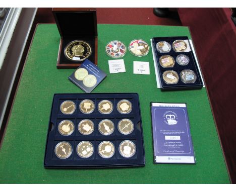 A Westminster Mint The Crown Jewels Twelve Coin Set, with certification. A cased London Mint Office 88mm Military Guinea Comm