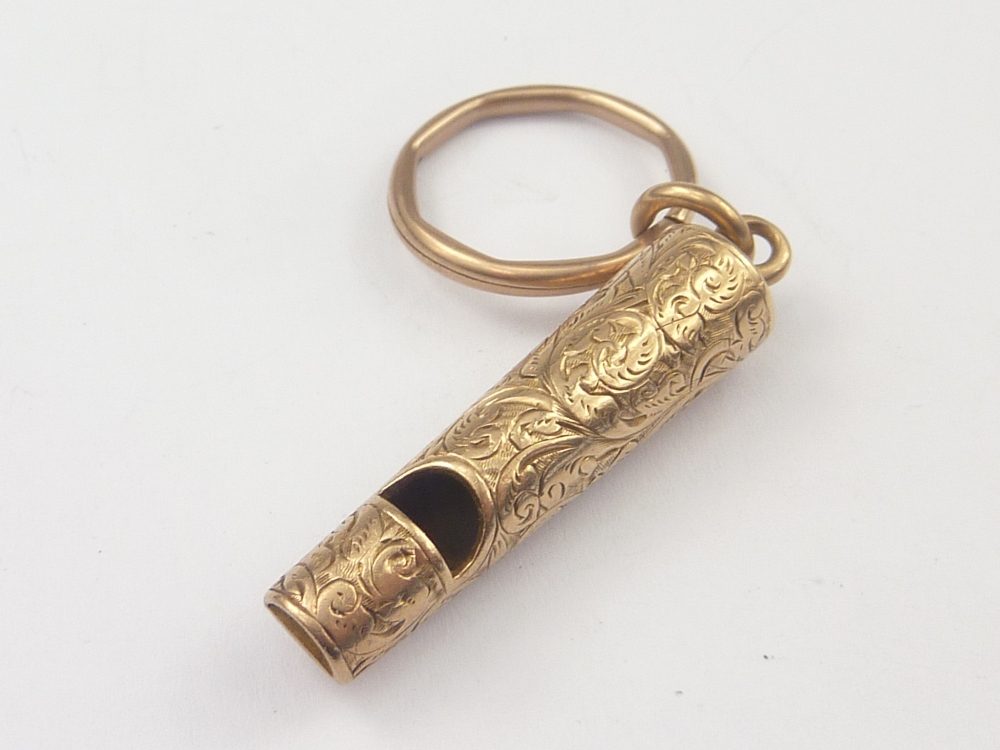 Engraved gold whistle on ring. Condition Report. Length 41mm to end