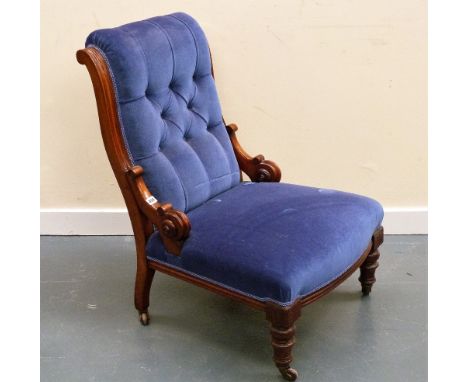 Victorian walnut framed button back ladies chair with scroll side rails on turned front supports, with castors.