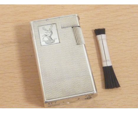 Dunhill silver cigarette lighter, engine turned and crested, 1961 in box.