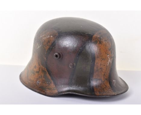 Imperial German M-17 Steel Combat Helmet, good example complete with the camouflage paint finish to the exterior. Complete wi