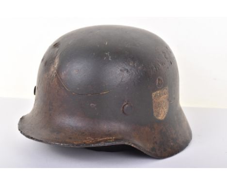 WW2 German Army Combat Helmet, being a refurbished M-40 pattern battlefield relic shell. The helmet has the remains of the or