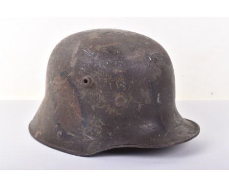 Imperial German M-16 Camouflaged Steel Combat Helmet, fine untouched example retaining a dark camouflage paint finish which i